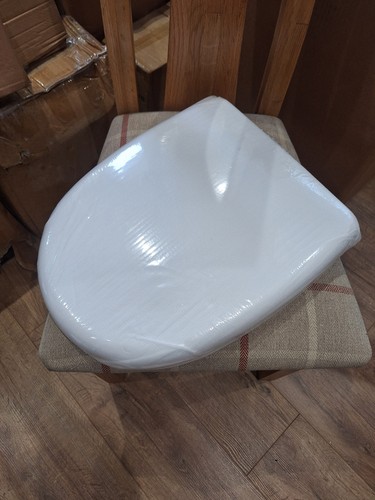 White plastic toilet seat with - plastic,